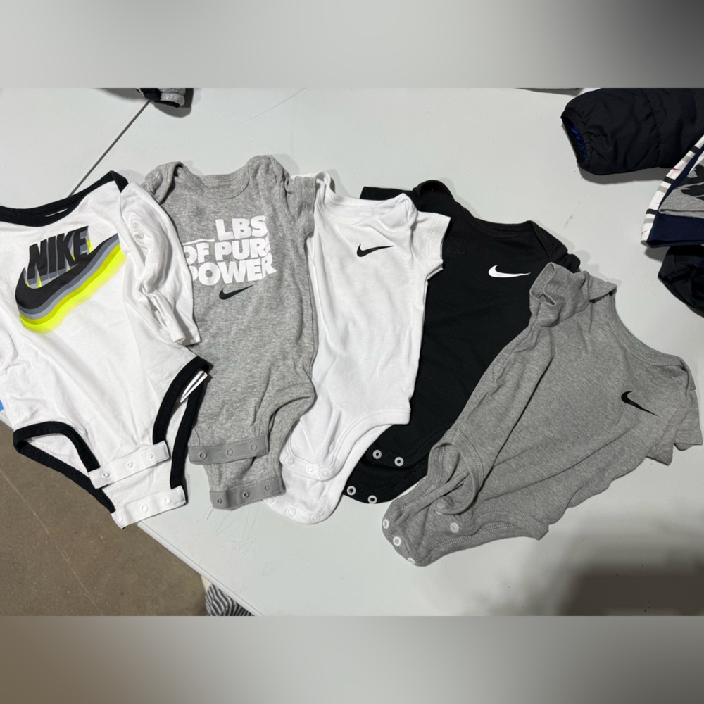 Nike Infant Onesies in Black, White, and Gray